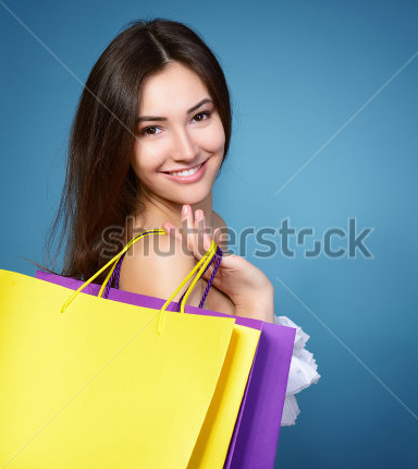 stock-photo-beautiful-shopping-girl-with-vivid-colored-sale-bags-over-blue-background-128994728.jpg